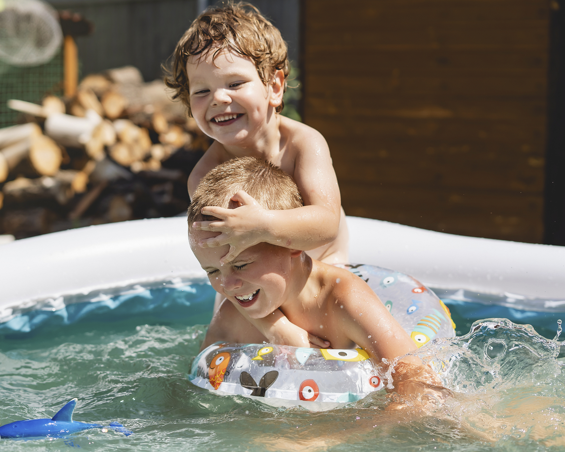 children playing in swimming pool during co-parent summer