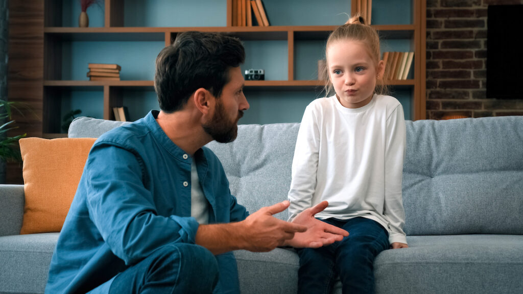 Caring father caucasian man dad trying to contact with offended child girl helping little kid daughter talking sincerely about misunderstanding problem mistrust between children and parents in family divorce mediator
