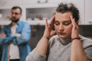 A conceptual image depicting a person looking confused or distressed, with shadowy hands manipulating their perception