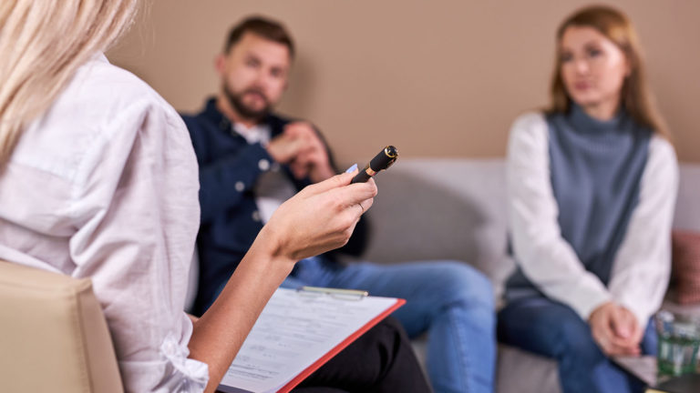 Alt text: mediator helping clients communicate